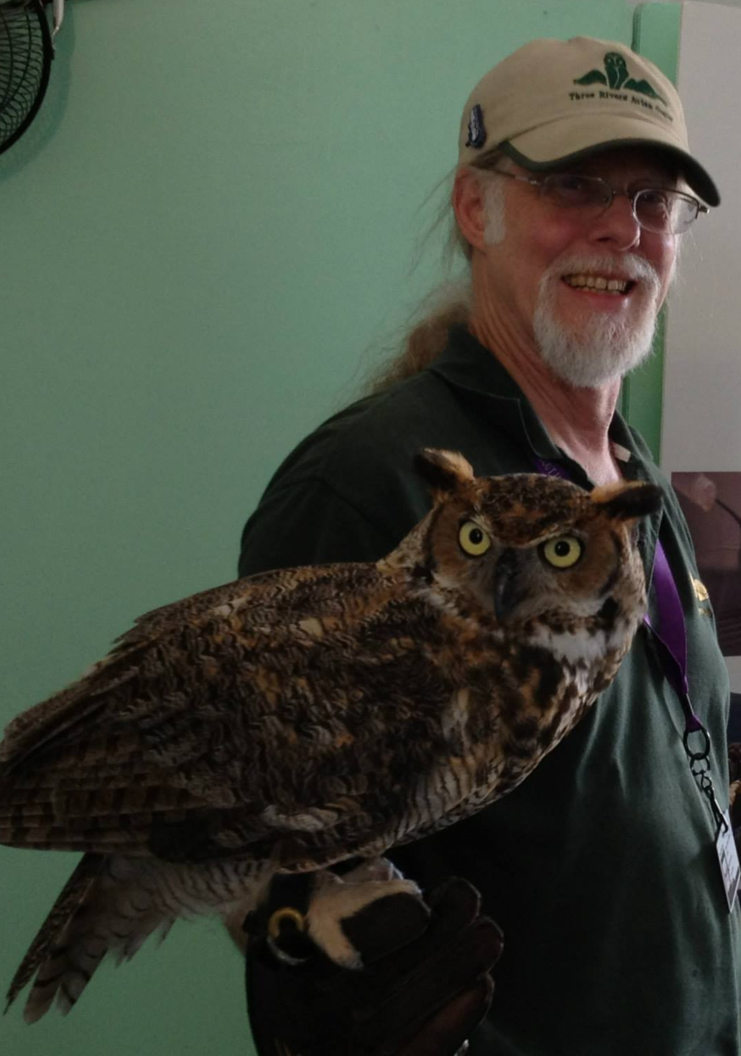 team member holding a bird